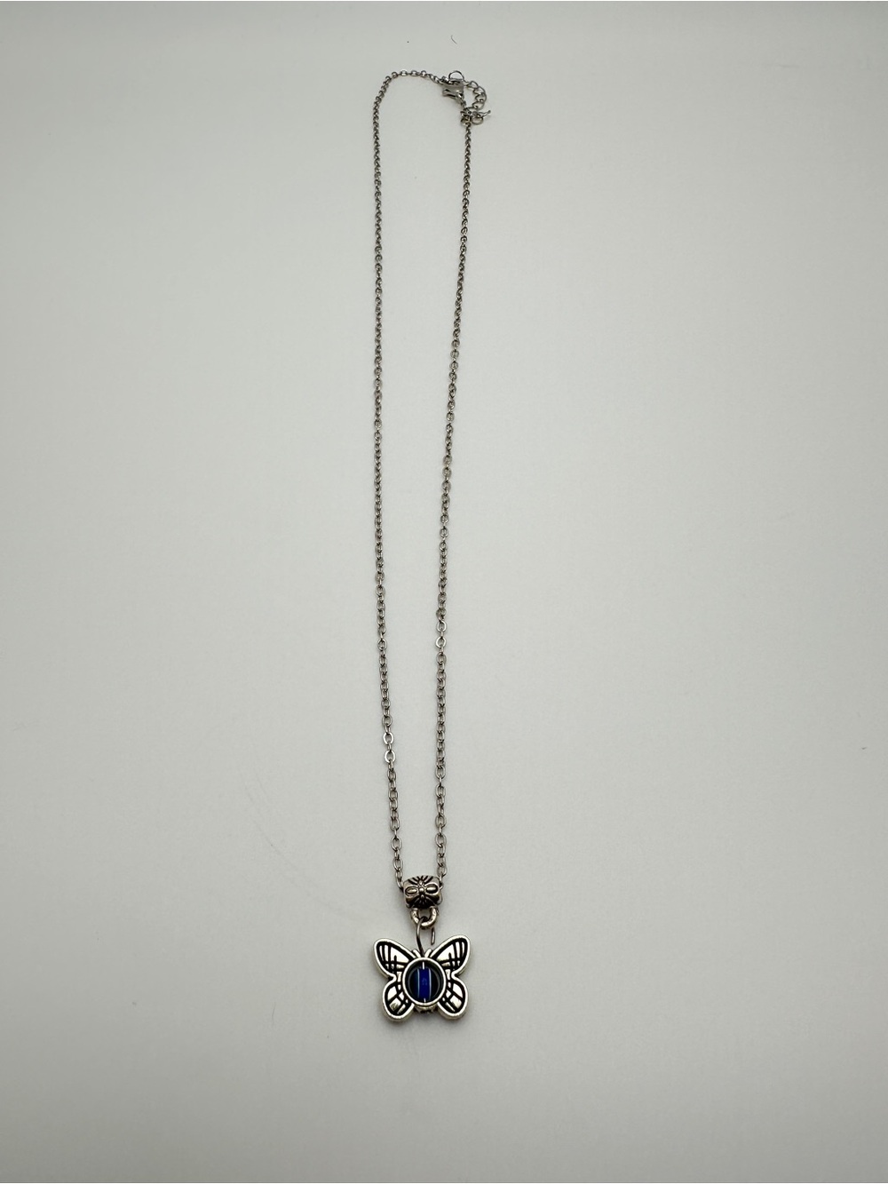 Silver Butterfly Pendant Necklace with Blue Stone